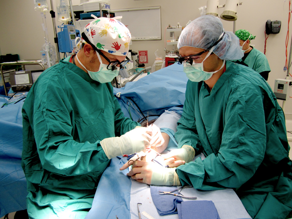Dr. Hutchinson and Fellow operating on Congenital Hand at Shriner's Hospital