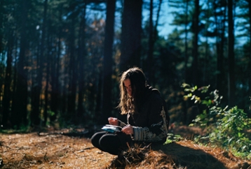 Student journaling outside