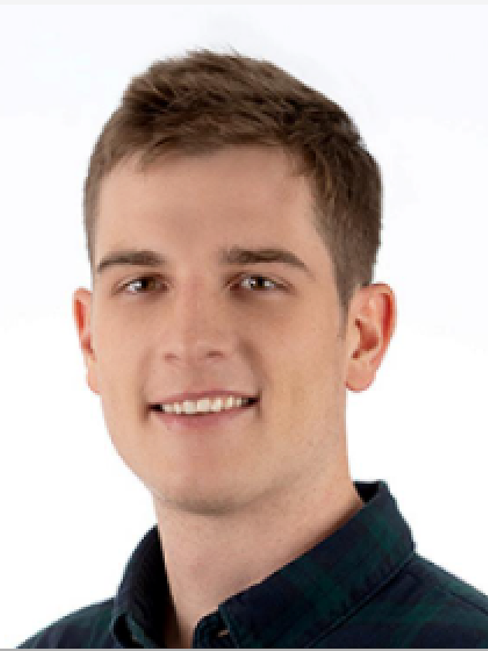 Resident Zane Jordan, in front of white background. 