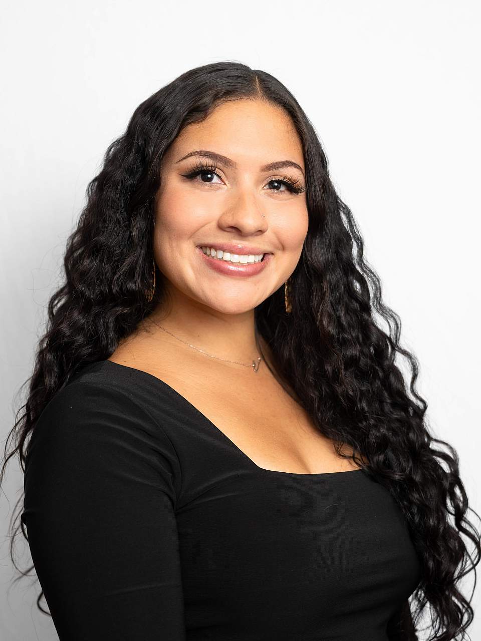 Headshot of Lia Bermudez in front of a white backdrop
