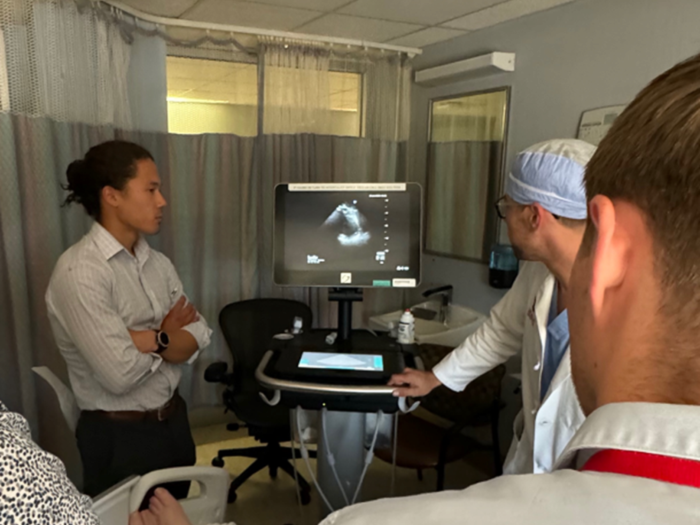 3 hospitalists in a hospital room
