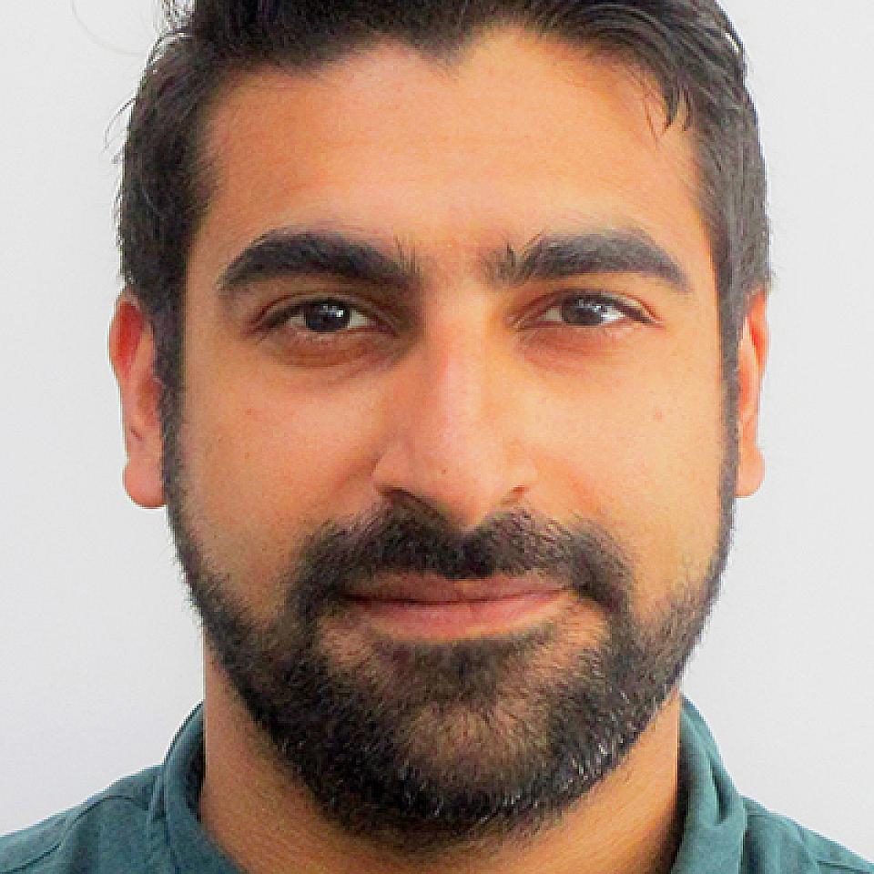 man with black hair and beard