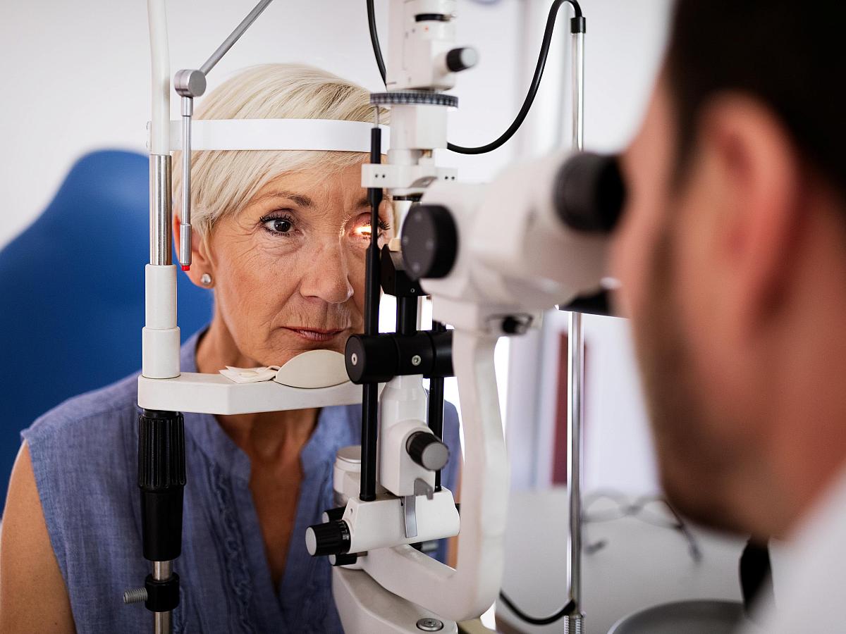 A patient receives an eye exam.