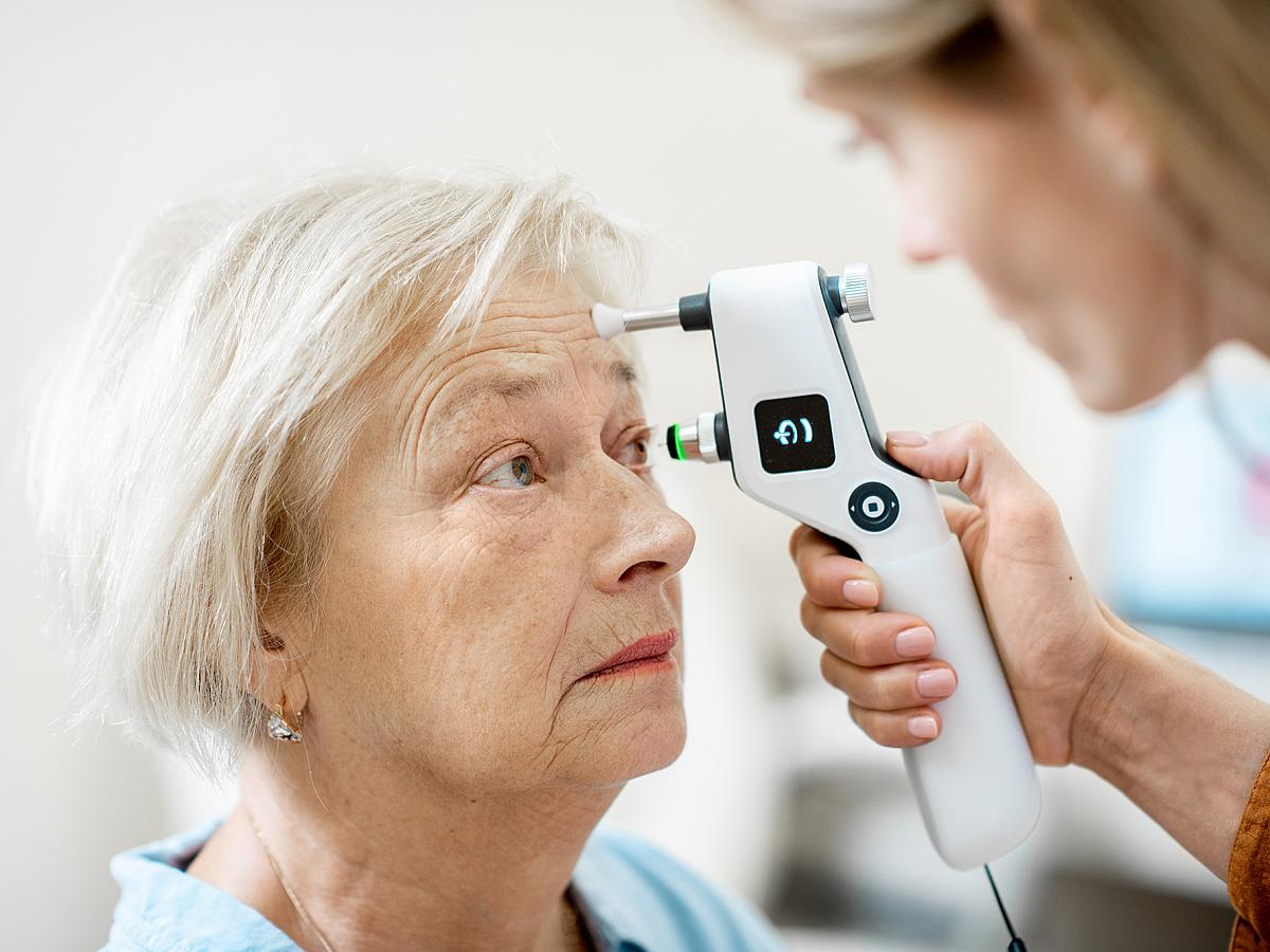 A woman receives an eye exam.