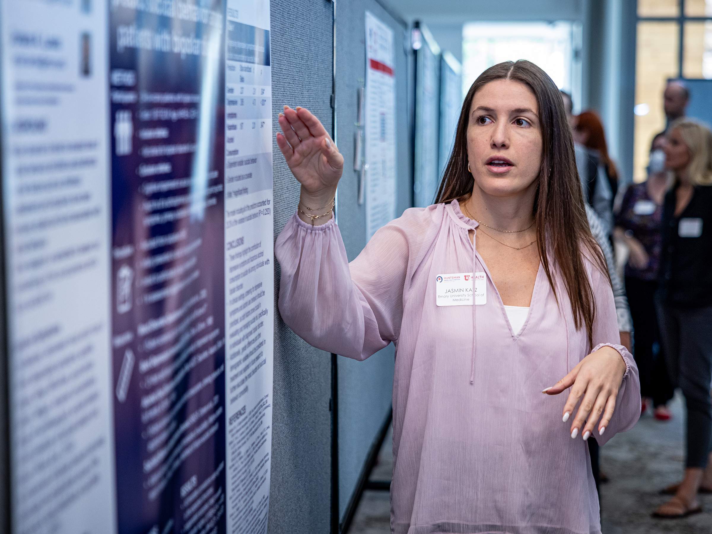 Student looking at a poster 