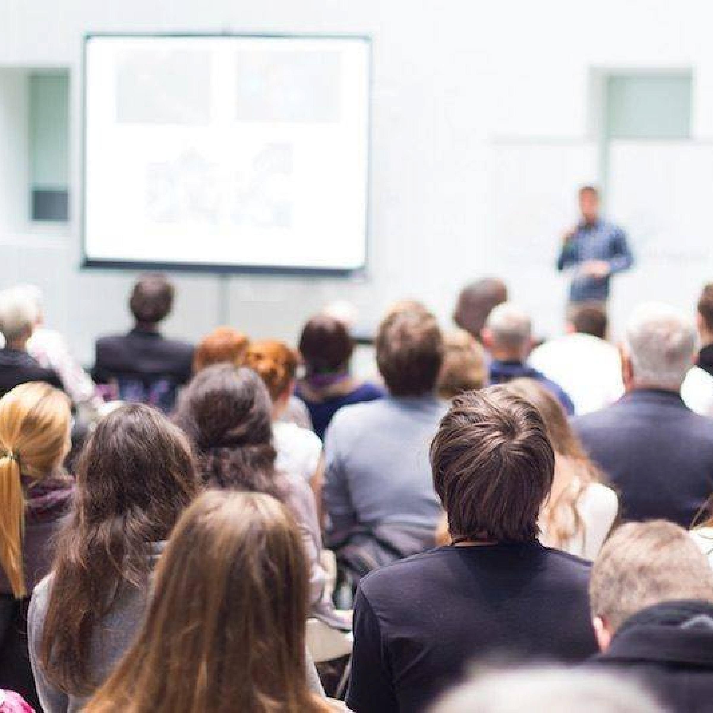 Conference attendees with speaker