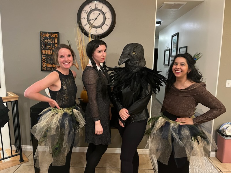 Four residents posed in Halloween costumes