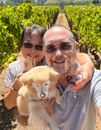 Dan Scoles, wife, and dog in vineyard