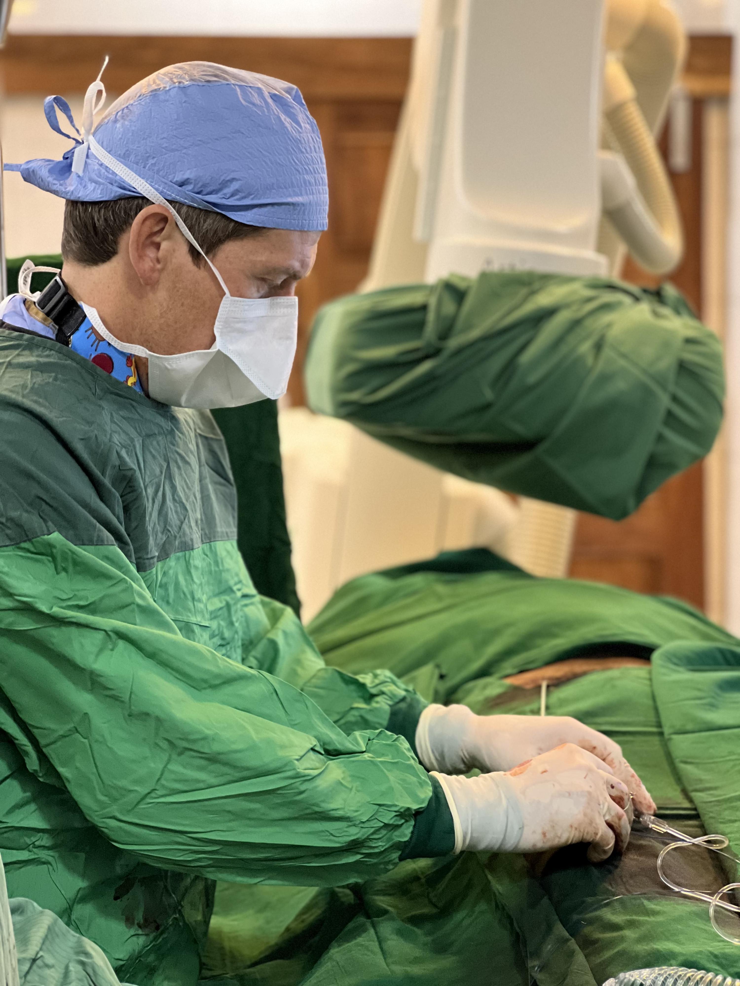 Karol Budohoski, MD, during a procedure in Tanzania