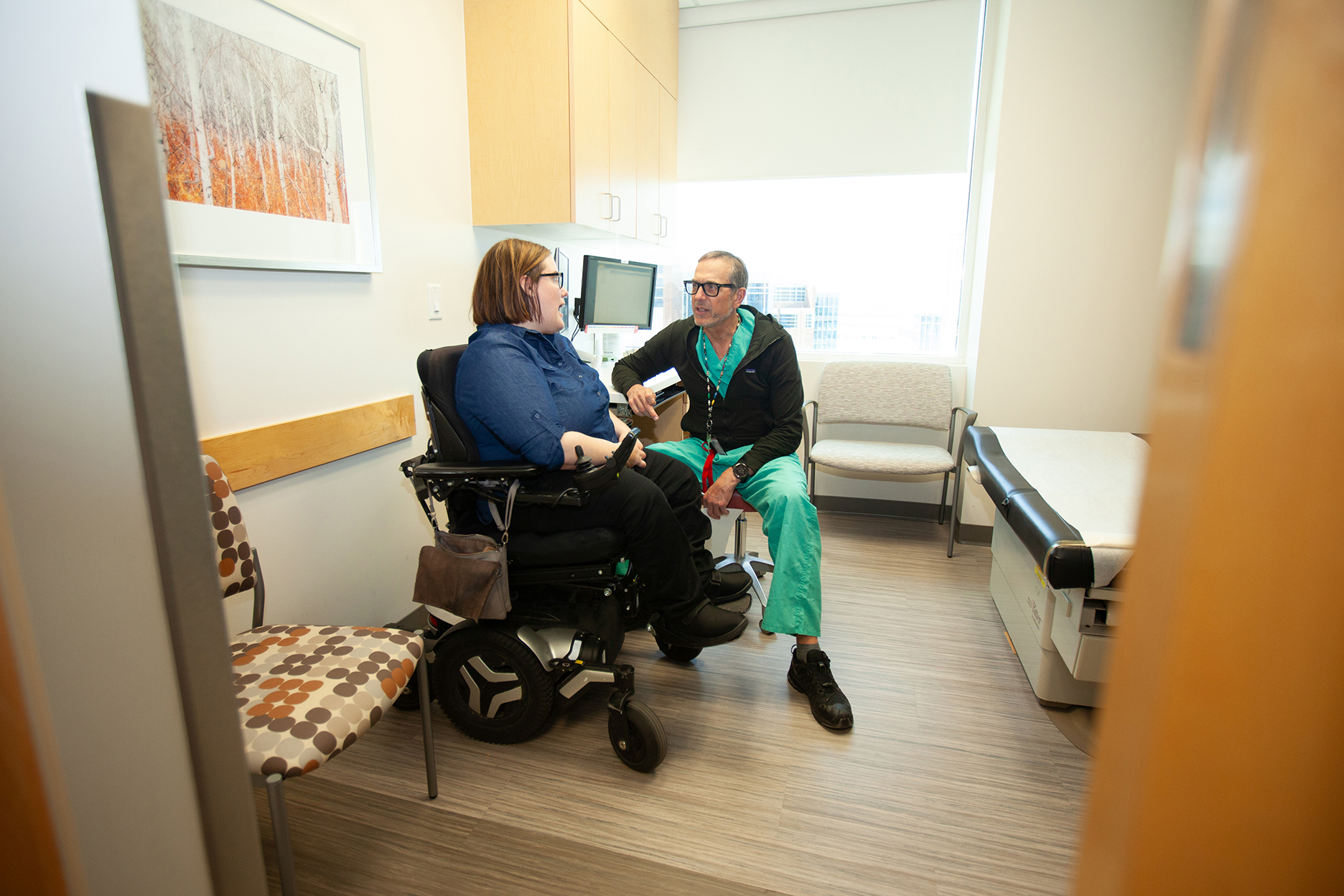 Dr. Brockmeyer meeting with a patient