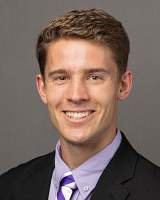 Headshot of Benjamin Packard wearing a suit jacket, light purple shirt, and purple and white tie