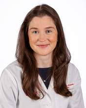 Madeleine de Lotbiniere-Bassett wearing her white coat