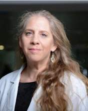 Professional photo of Deborah Blumenthal wearing a white coat