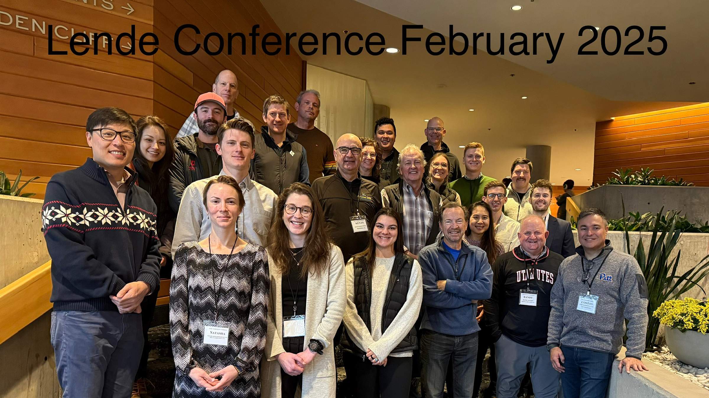 Group photo of the Lende Conference participants standing on a short staircase.