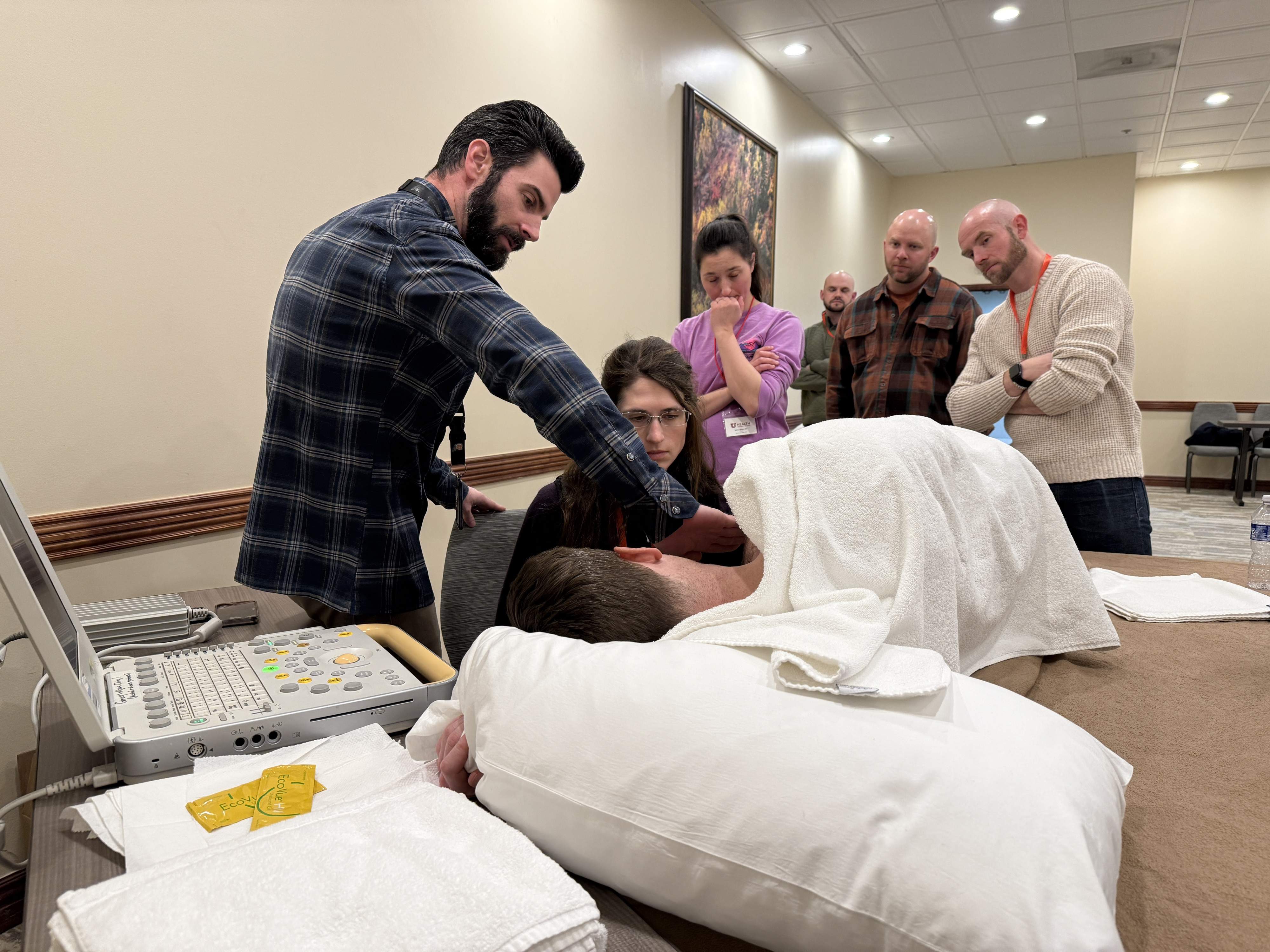 Attendees of the postgraduate conference engaging in a demonstration.