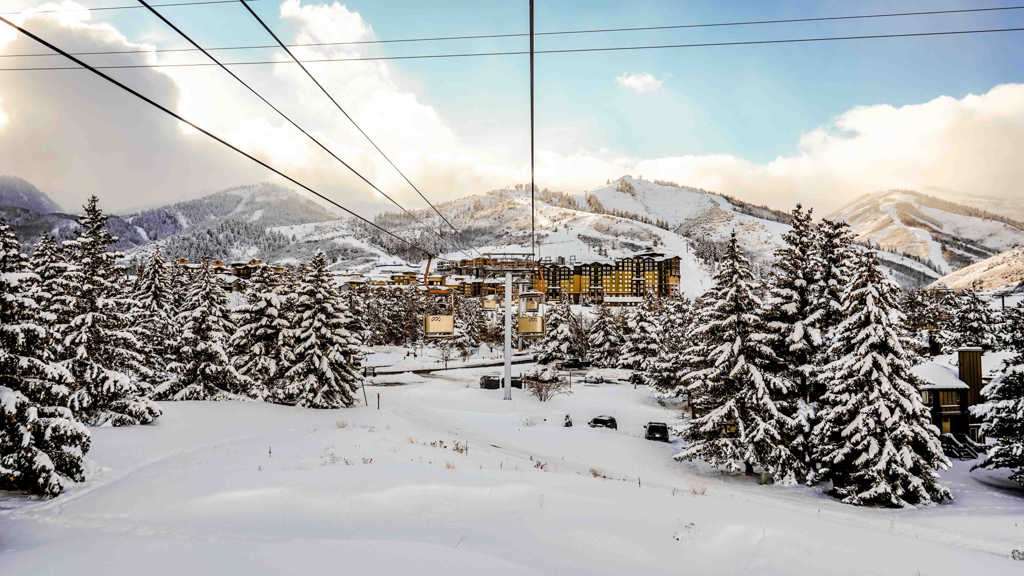 Park City Mountain ski lifts with a resort in the background.