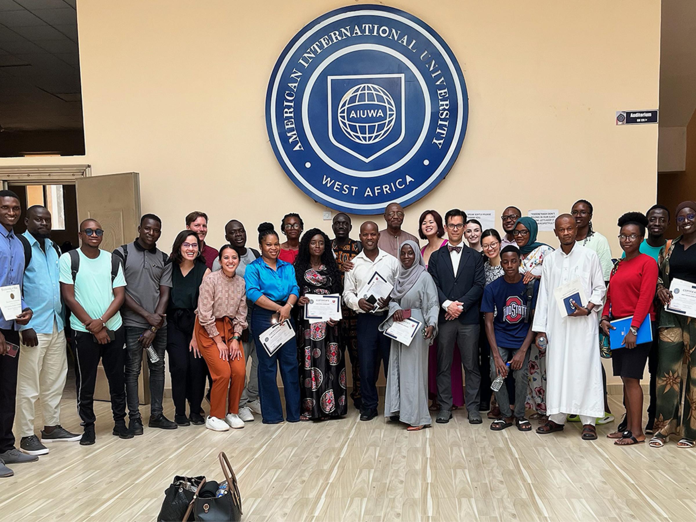A group photo of 27 people who participated in the workshops and conference.