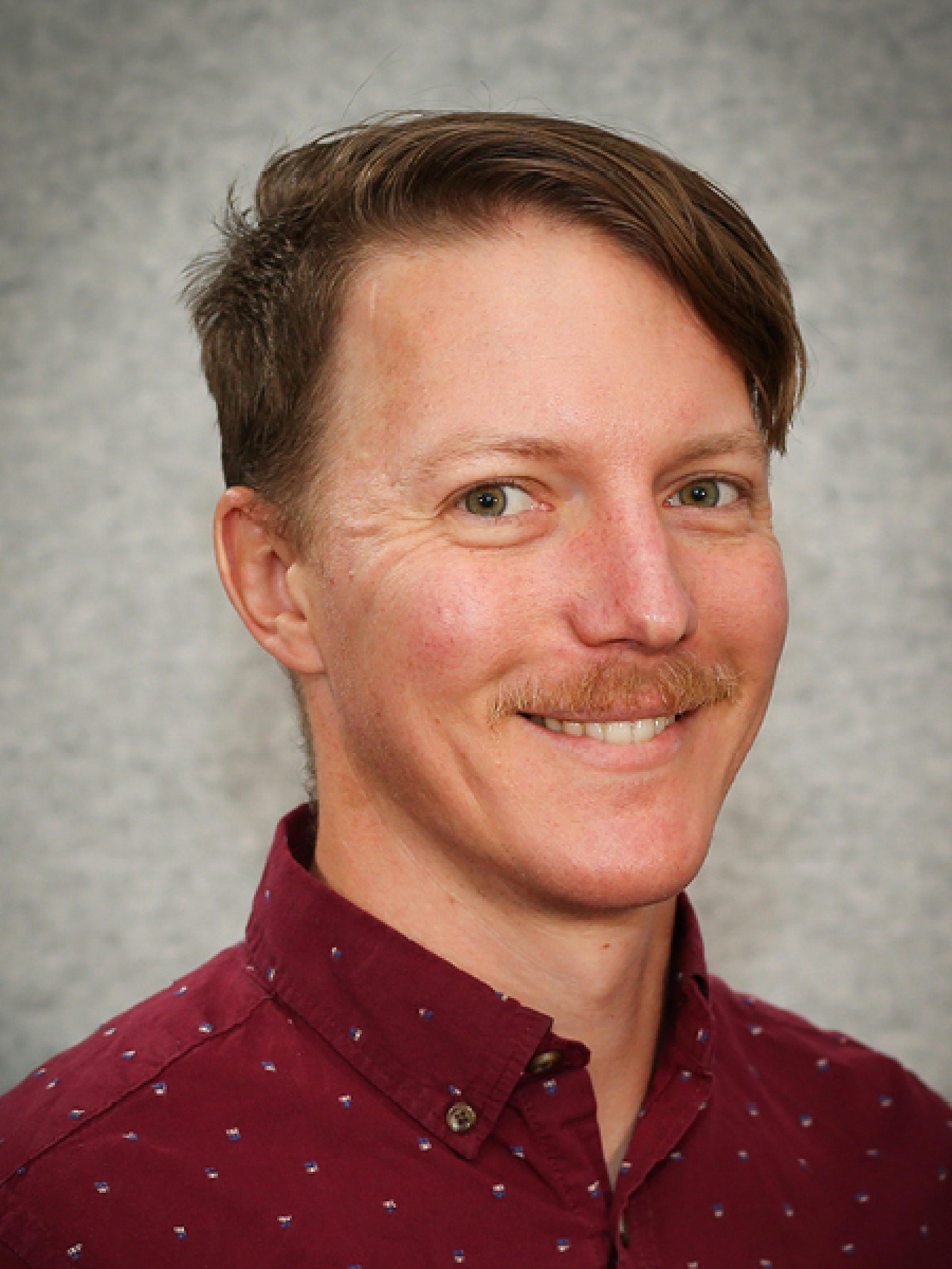 A portrait of Arran Seiler, MD