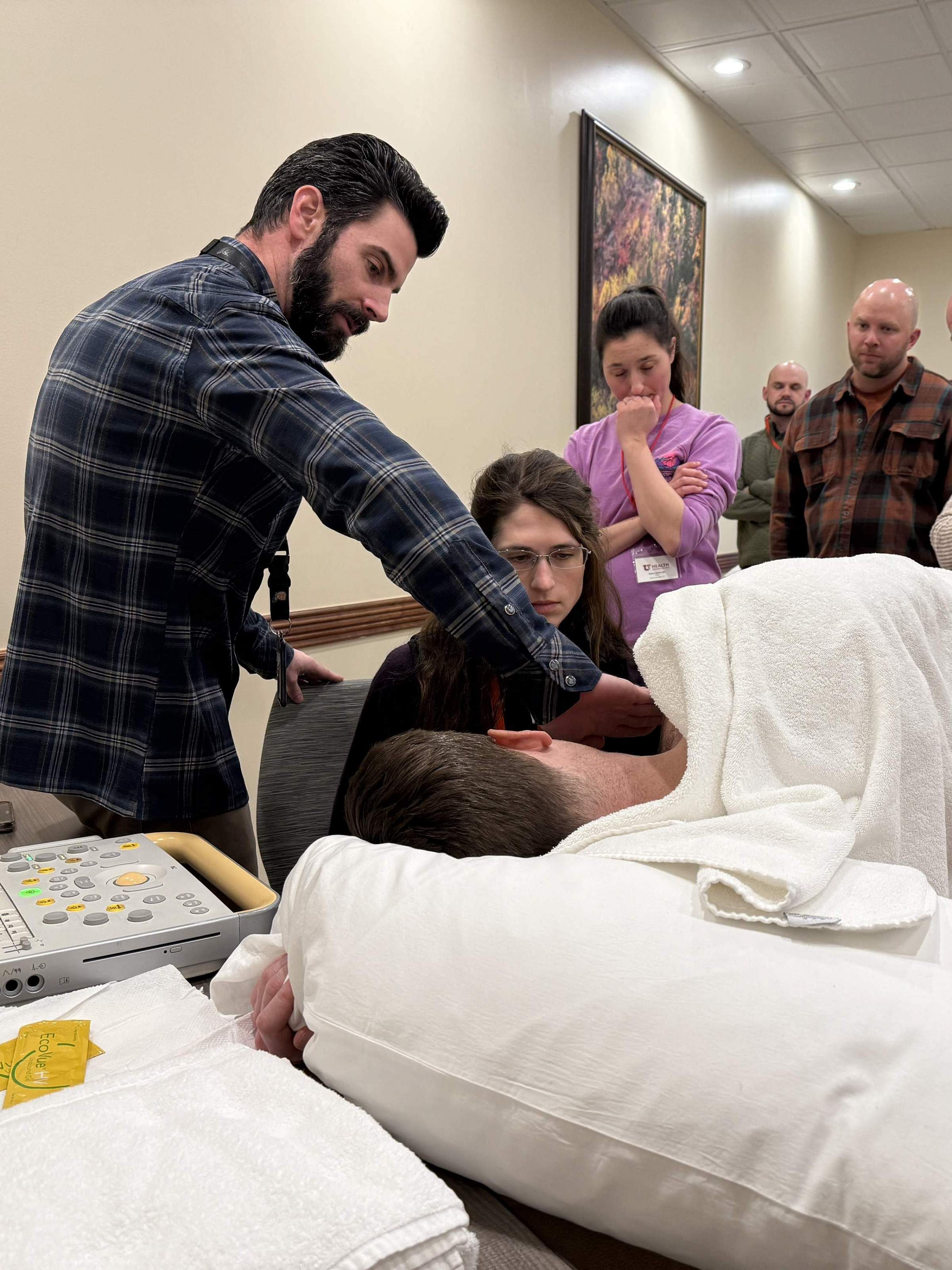 Attendees of the postgraduate conference engaging in a demonstration.