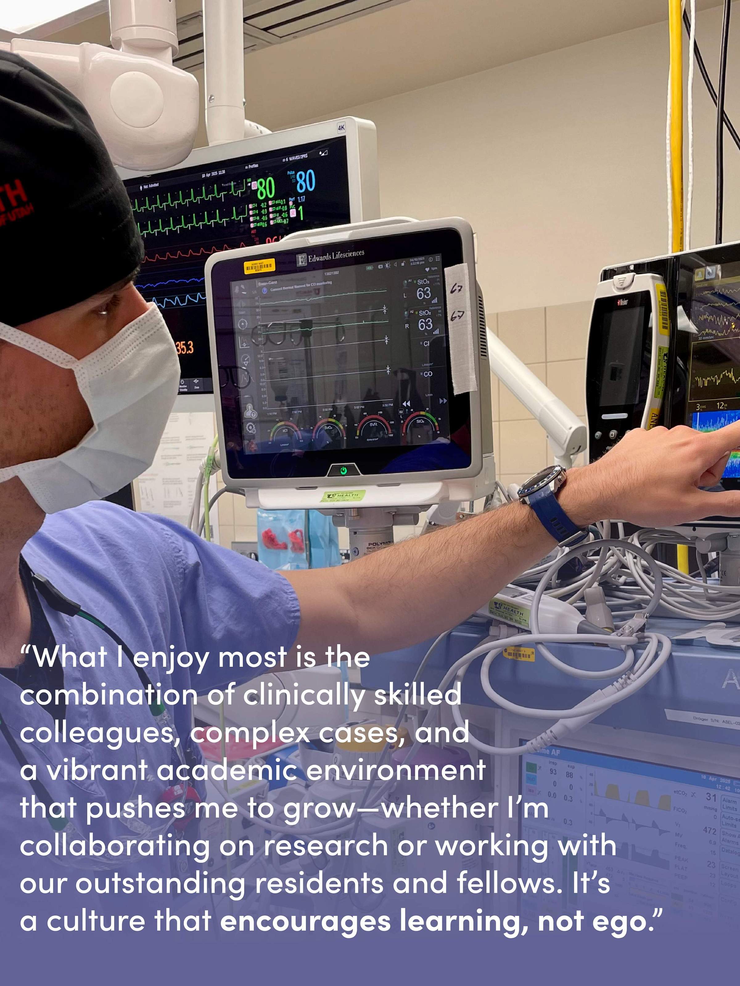 Dr. Guay in the operating room wearing scrubs and pointing to an EEG monitor.