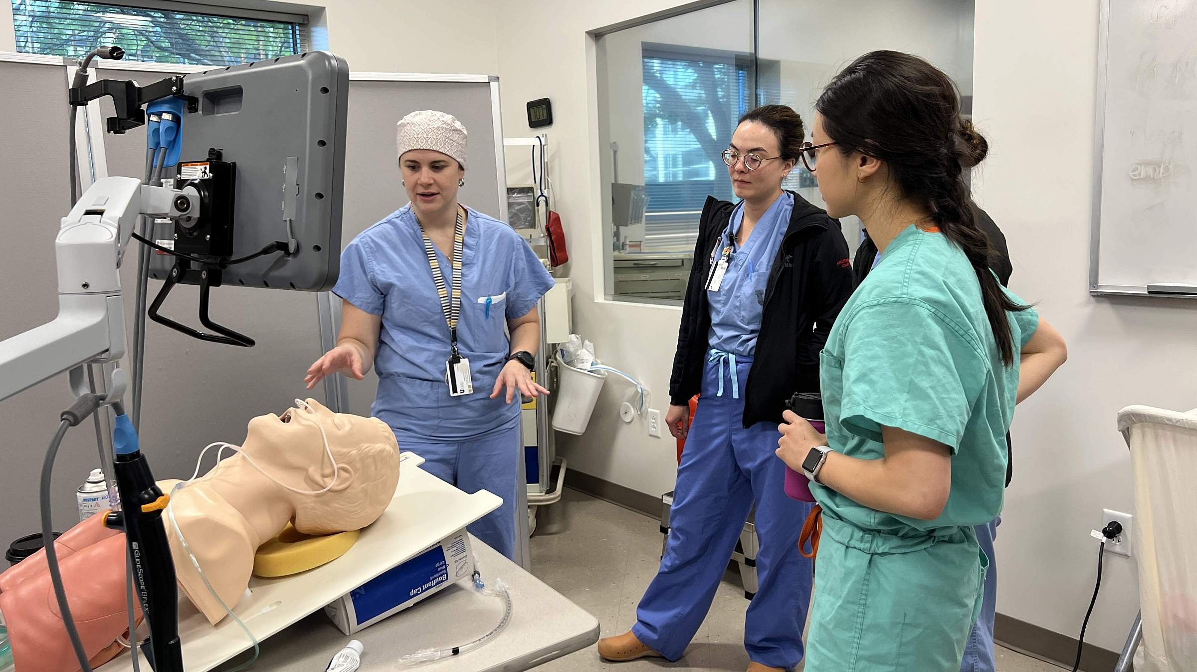 Four participants at a demonstration hosted at the Center for Patient Simulation