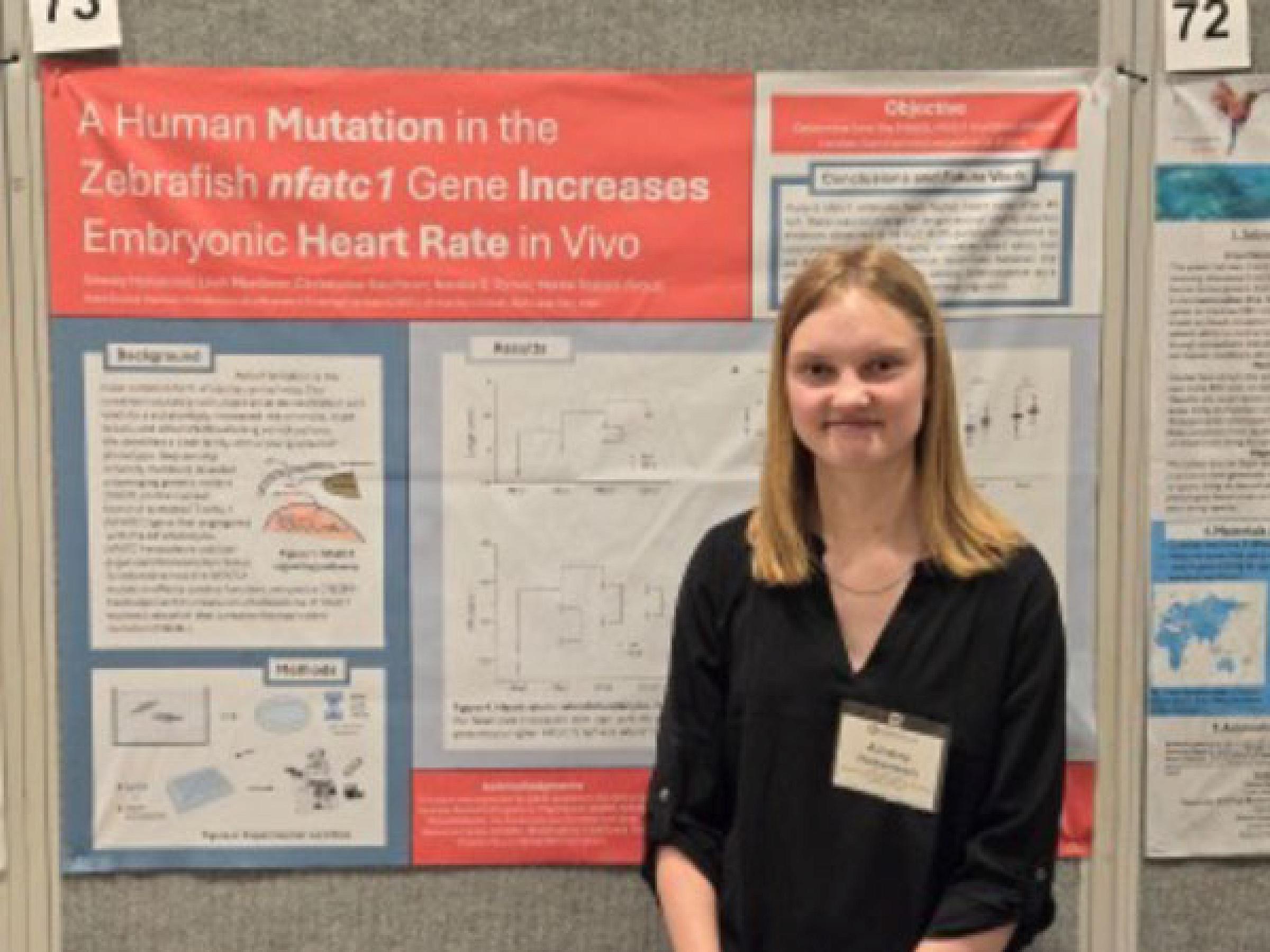 Ainsley Hokanson with research poster