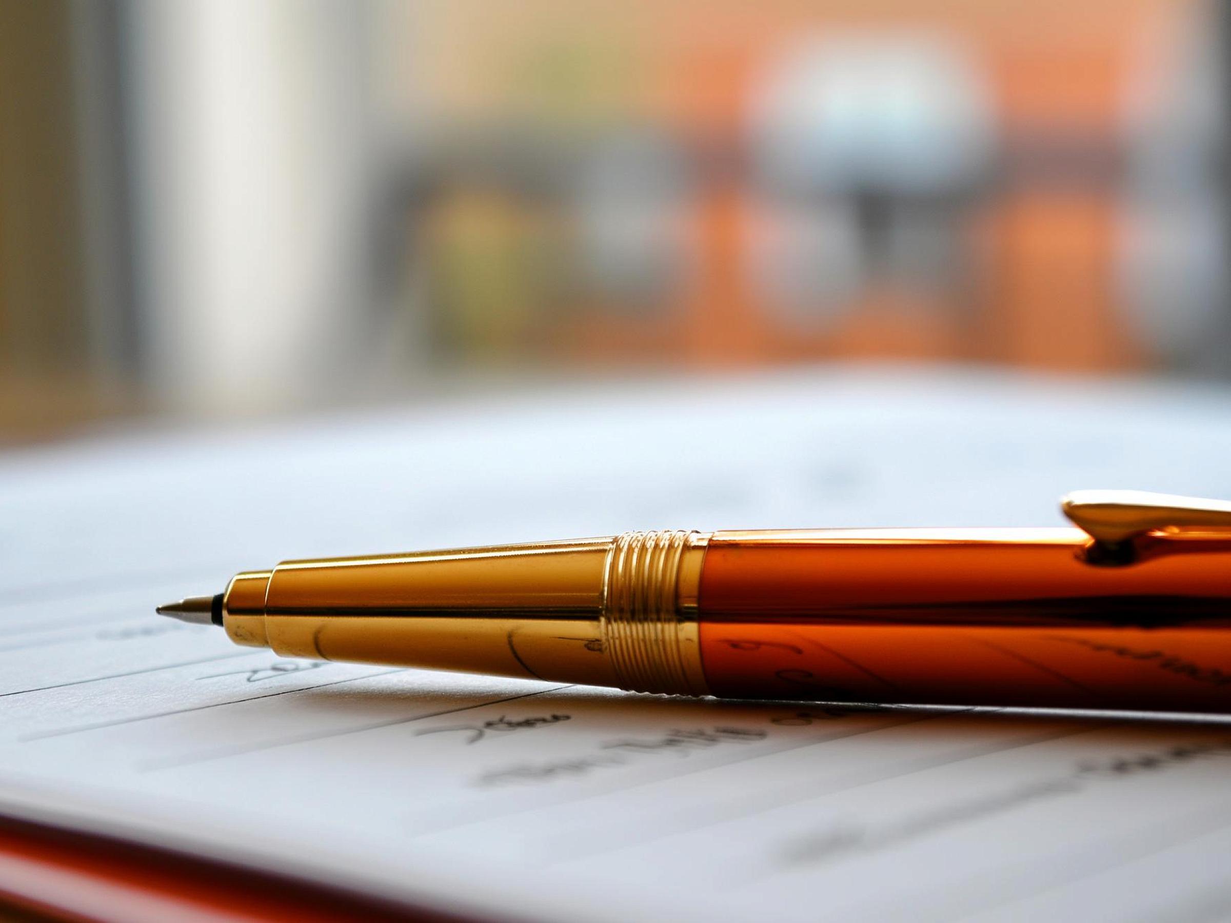 Pen lying on a notepad