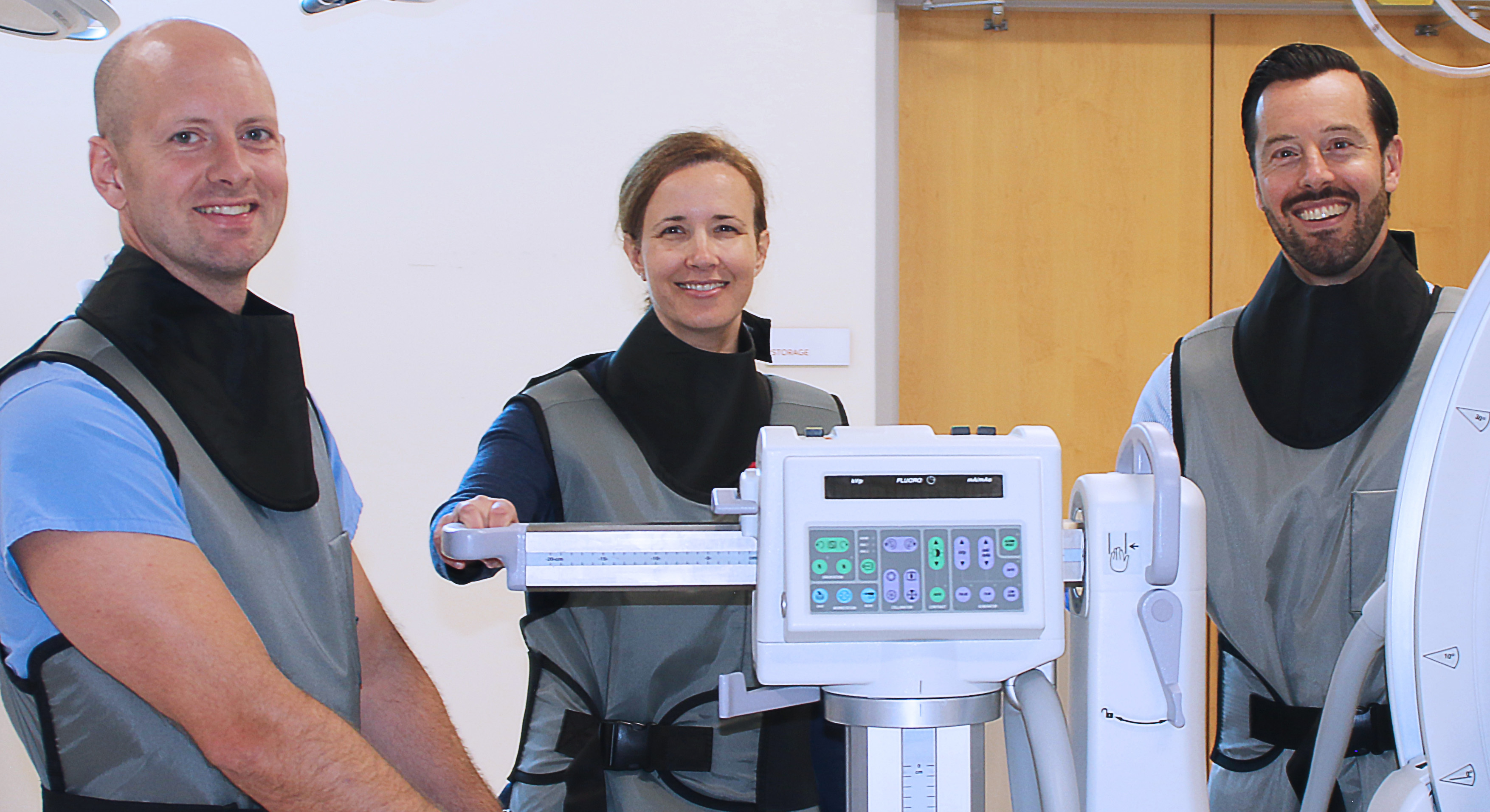 Picture of INSPIRE research faculty standing with equipment